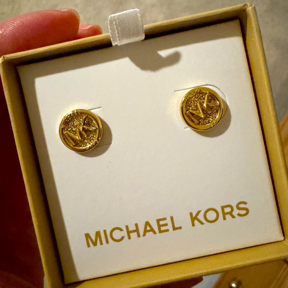 Gold Michael Kors stud earrings and matching bracelet